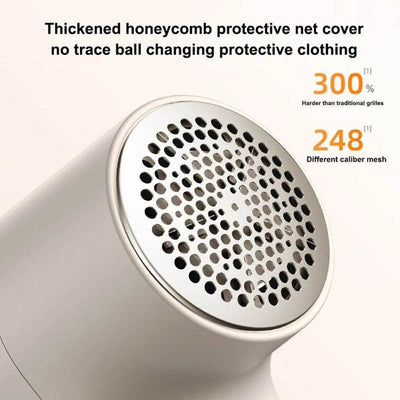 Close-up of Digital Fabric Lint Remover in use on cotton fabric