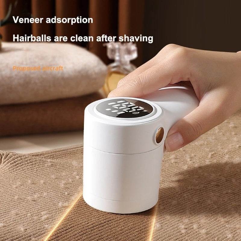 Close-up of Digital Fabric Lint Remover in use on cotton fabric